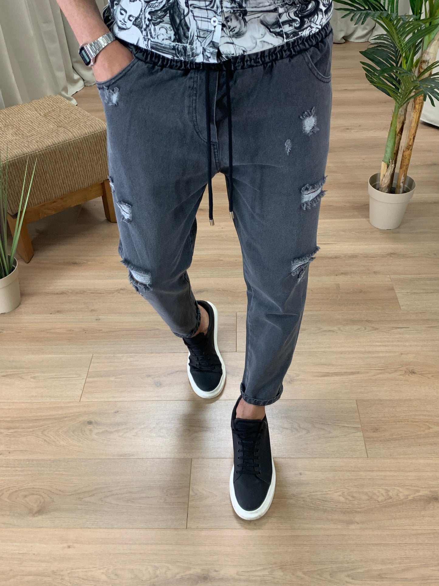 Jeans Walker con elastico in vita e rotture col. Nero